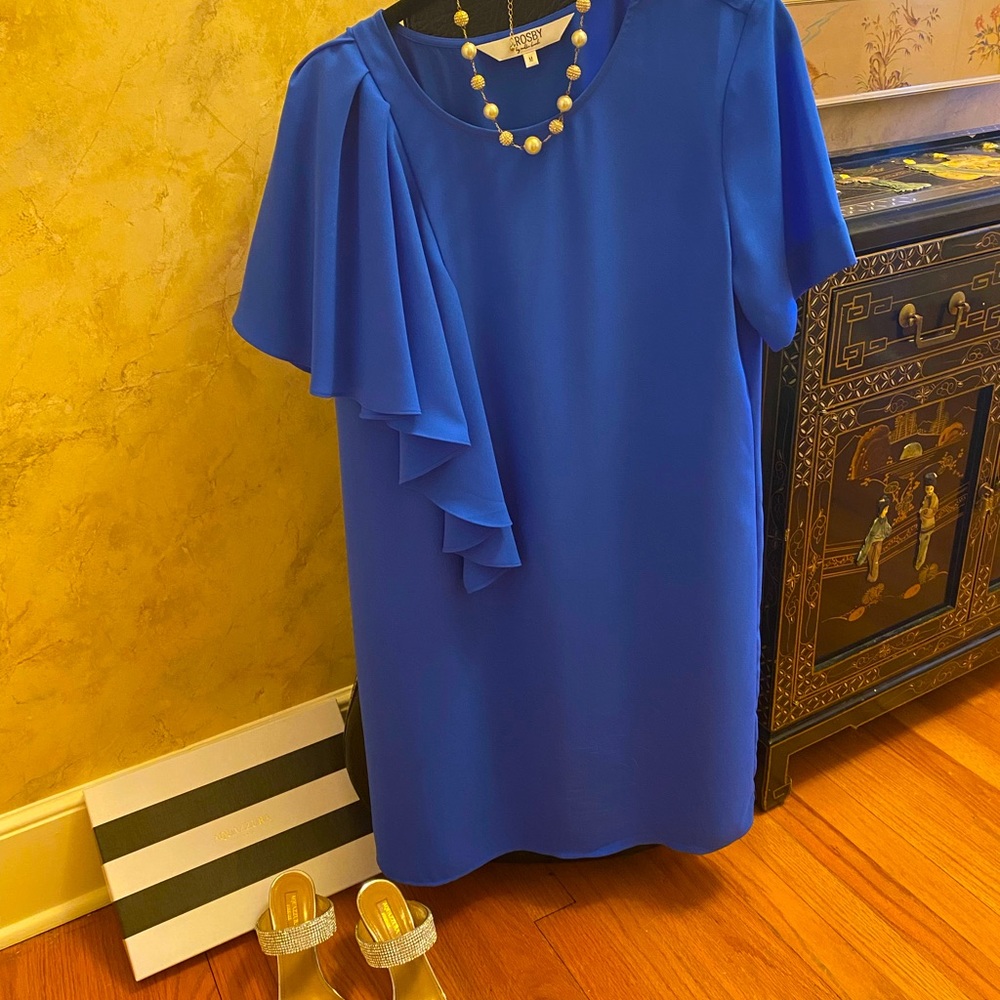 Lined. Machine wash delicate. Great quality and so flattering! Boutique item.